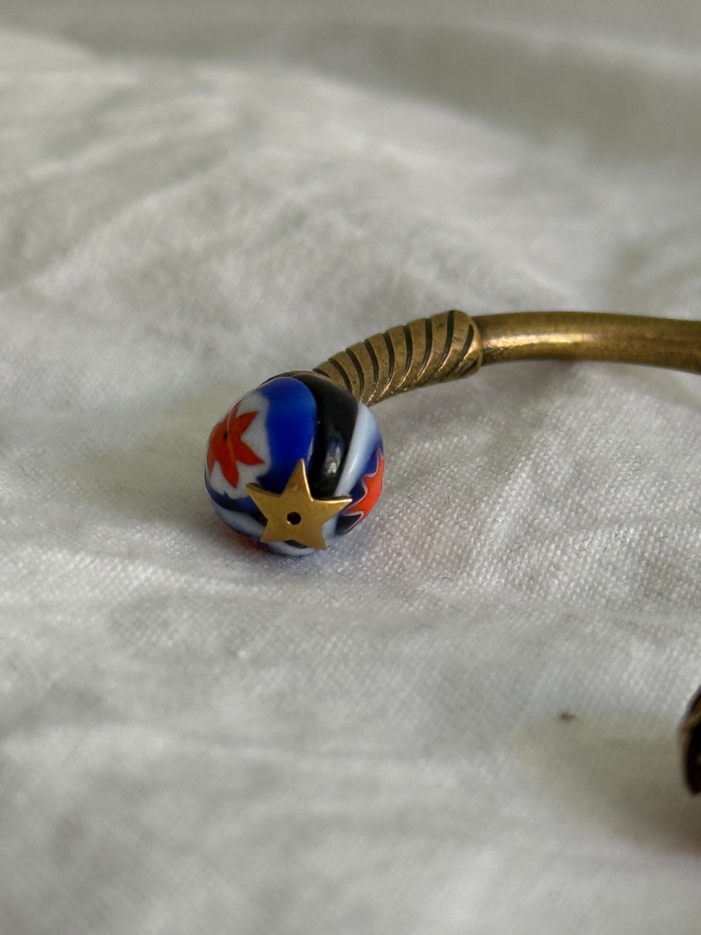 Dior Logo Cuff Bracelet With Star Detail in Antique Gold-Finish Metal