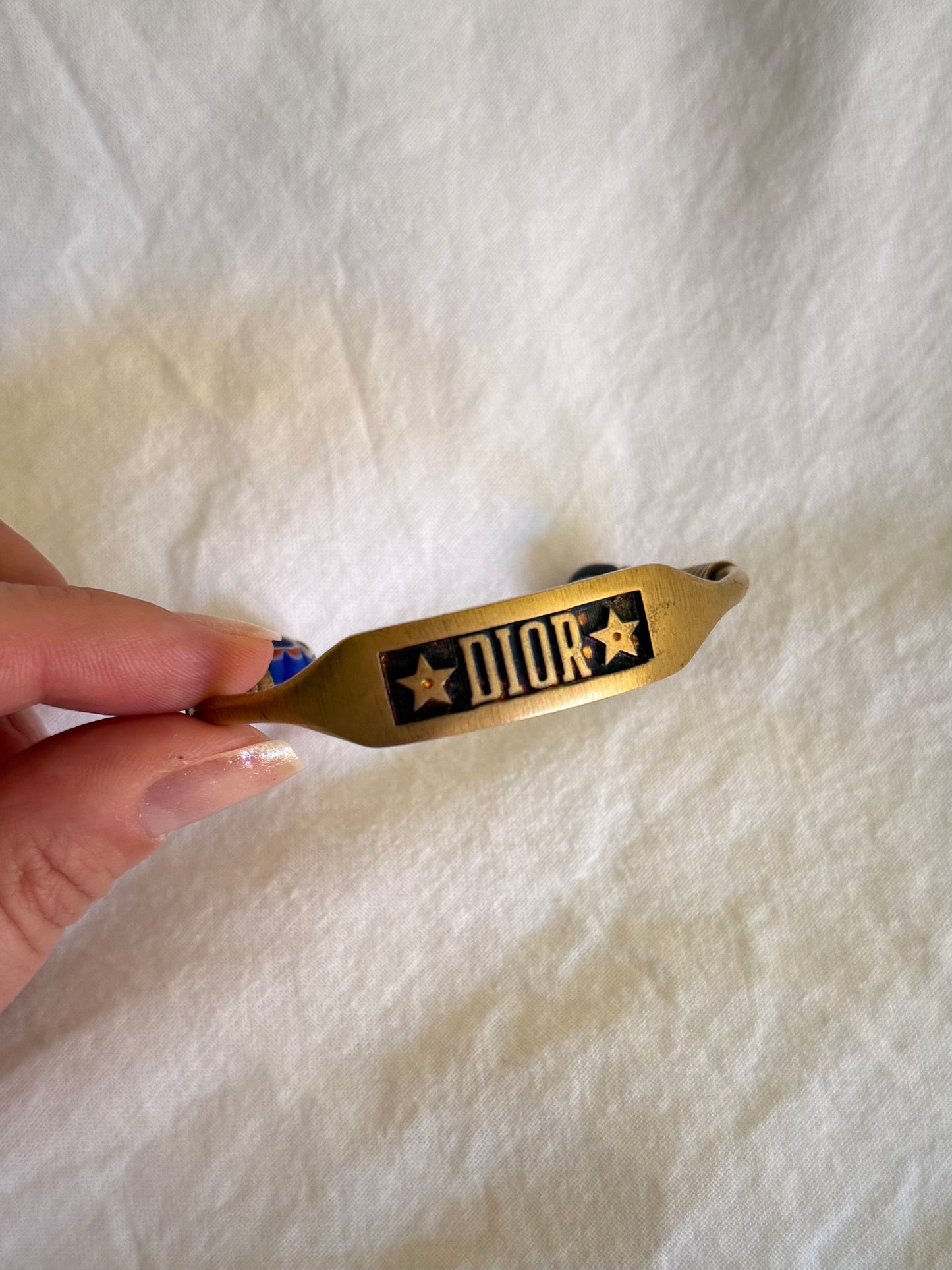 Dior Logo Cuff Bracelet With Star Detail in Antique Gold-Finish Metal